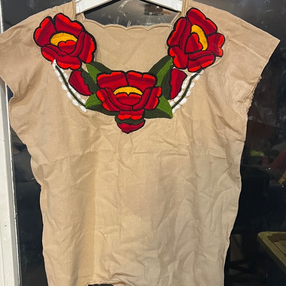 Chic Tan Blouse with Bold Red Floral Design